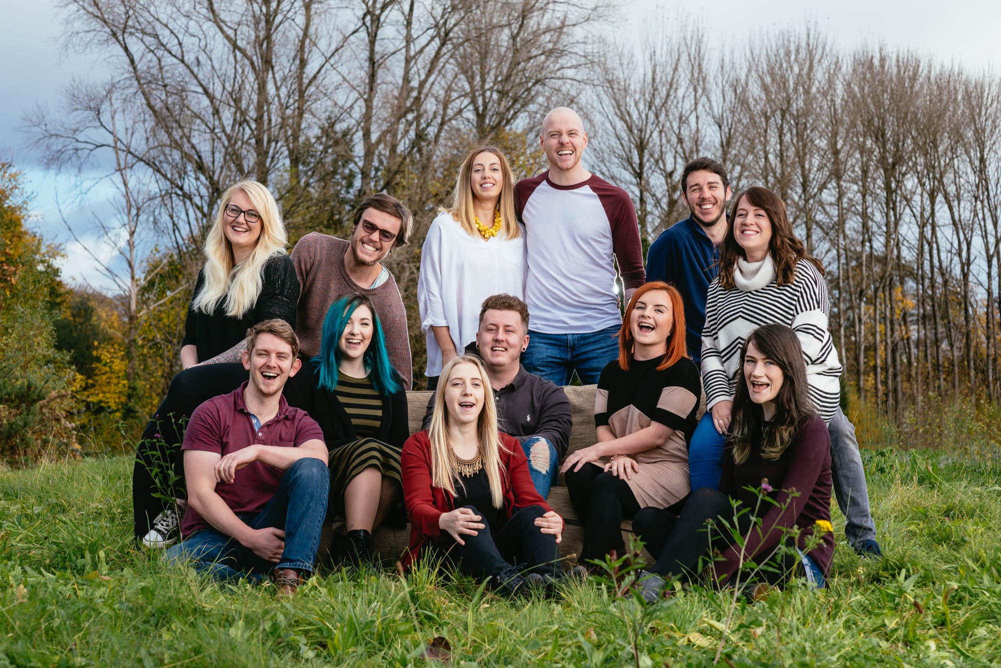A team photo of the staff of dust and things laughing