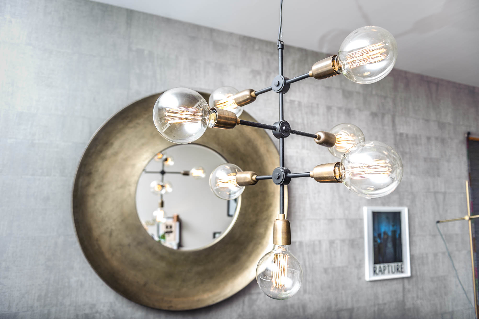 A photo of a bare bulb designer lamp in a modern home in cardiff
