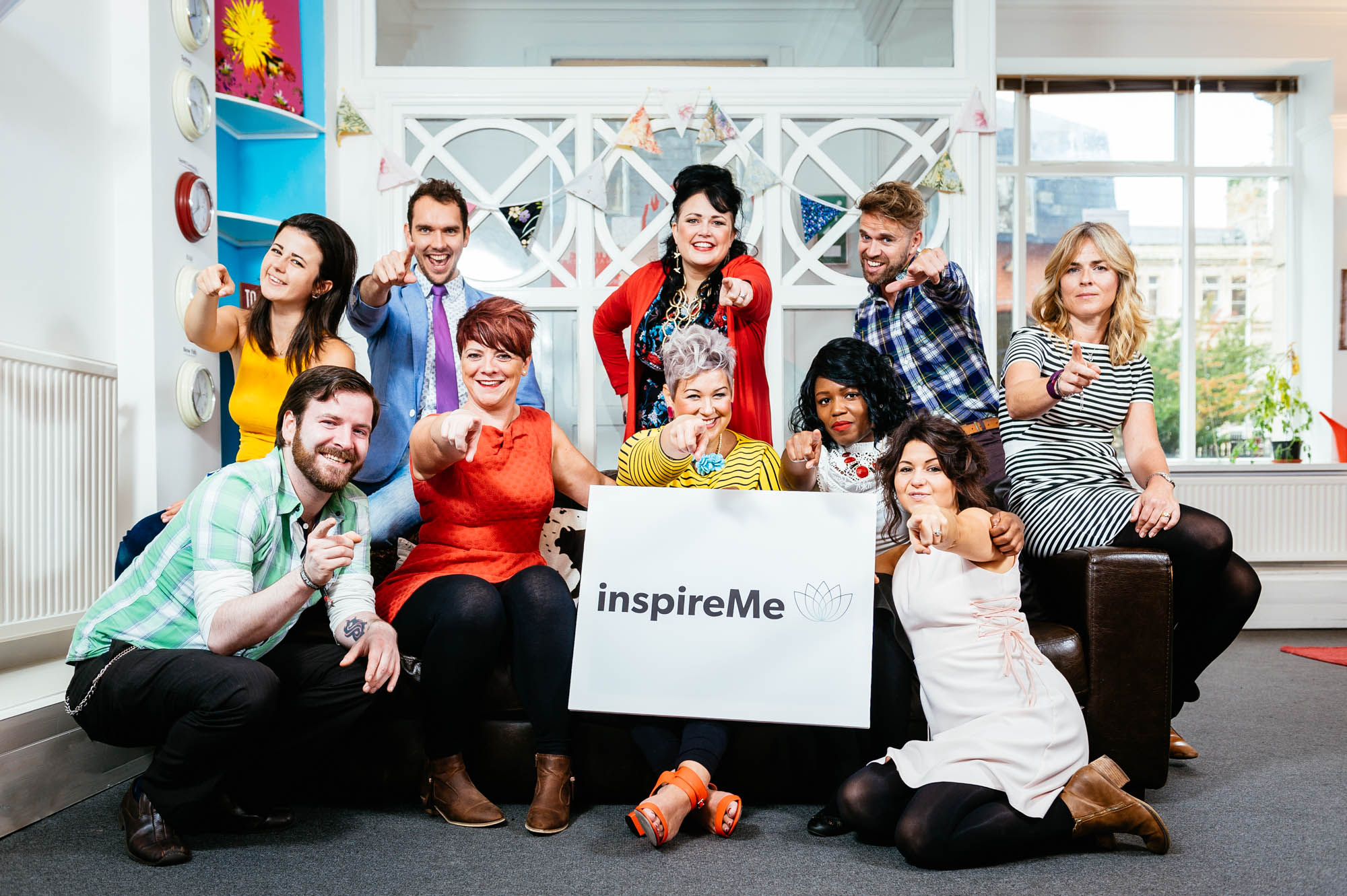 A team photo of a fun team in a colourful office